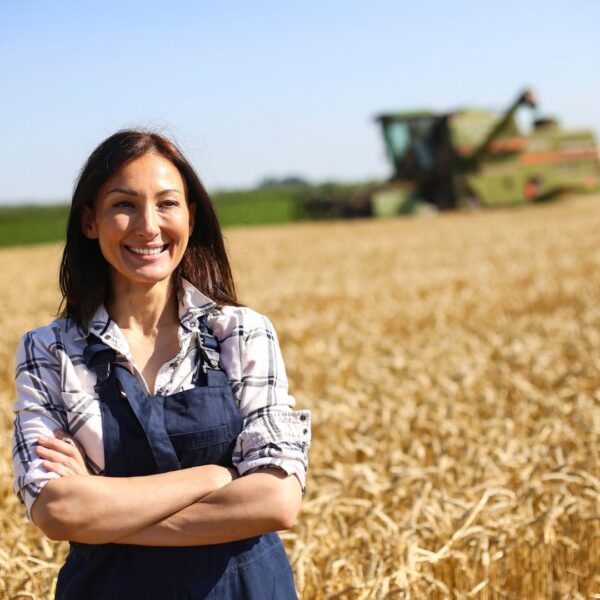 smiling female farmer in field 