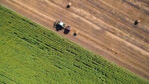 aerial view of round baler in field