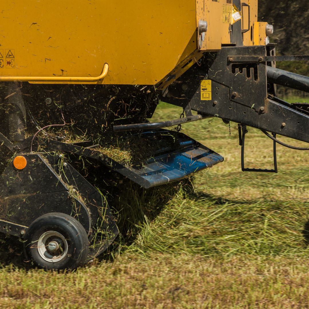 Yellow hay baler.