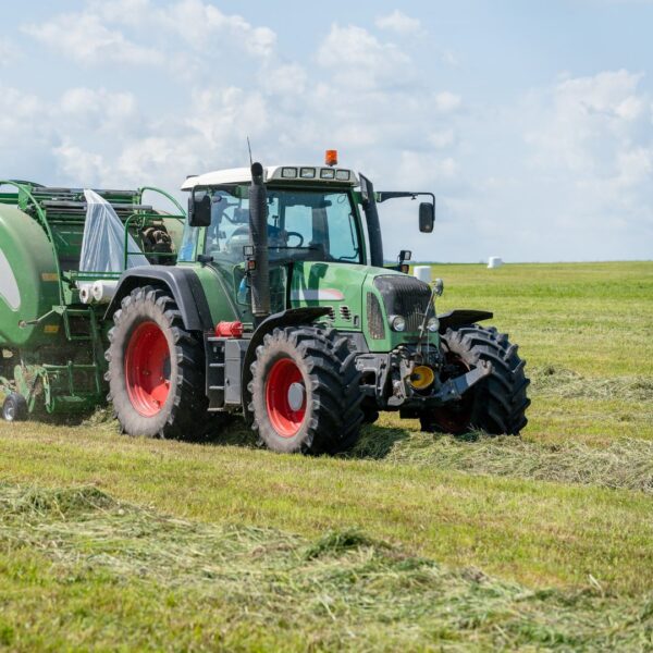 Green farming equipment on a field