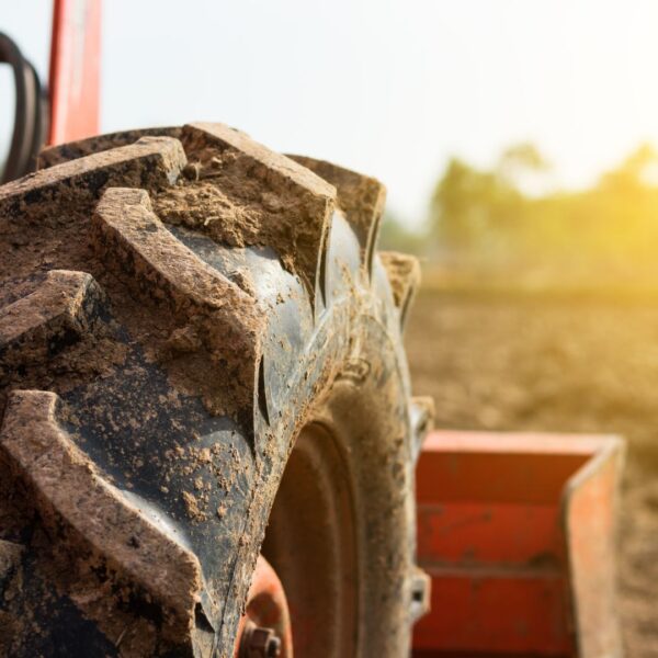 Close-up of a wheel on a piece of farming equipment