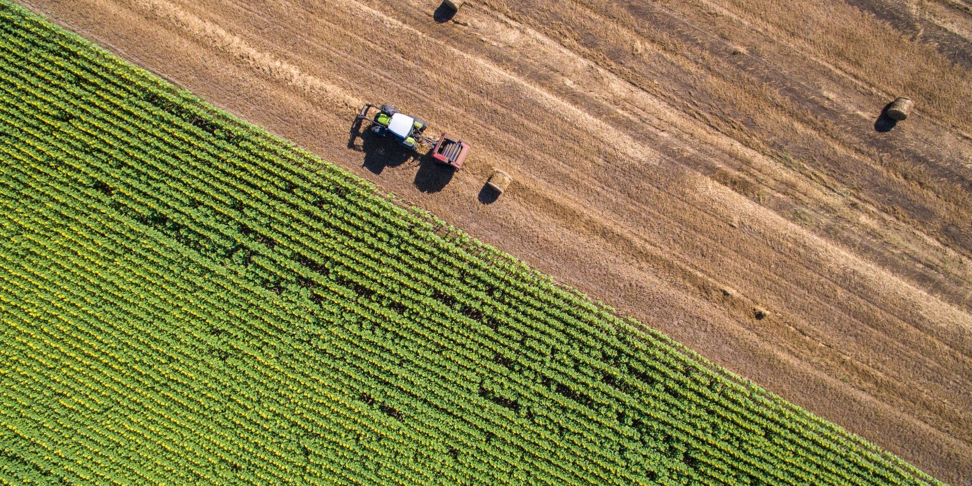 aerial view of round baler in field